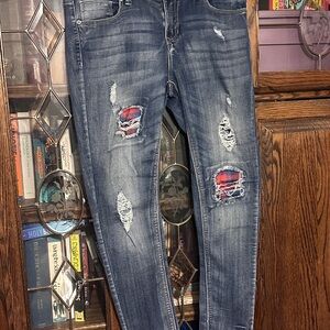 Distressed Denim Jeans with Red Accents